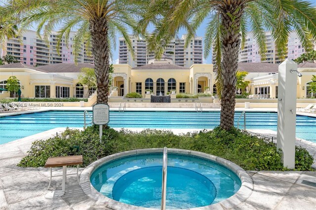 view of pool featuring a hot tub