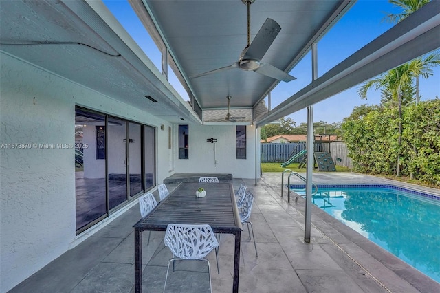 view of pool with a fenced in pool, a patio area, a fenced backyard, and ceiling fan