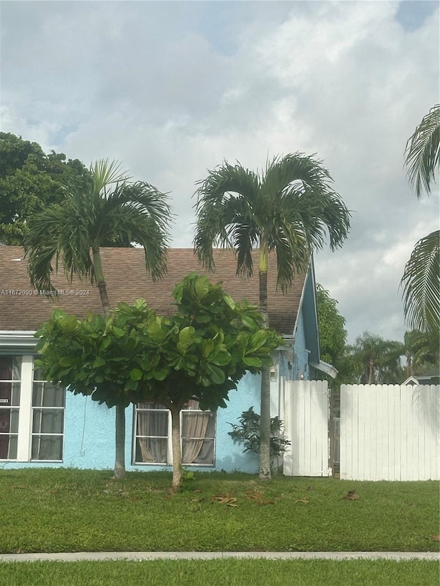 view of home's exterior featuring a yard