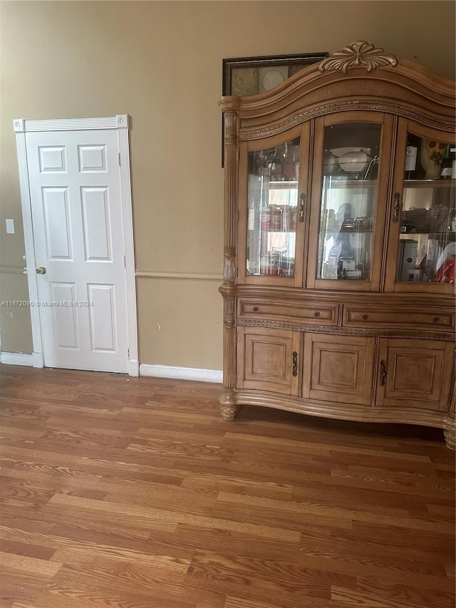 unfurnished dining area with wood-type flooring