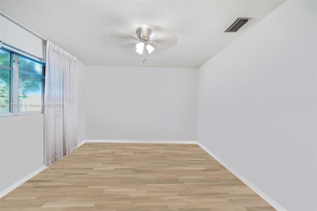 unfurnished room with ceiling fan and light hardwood / wood-style flooring