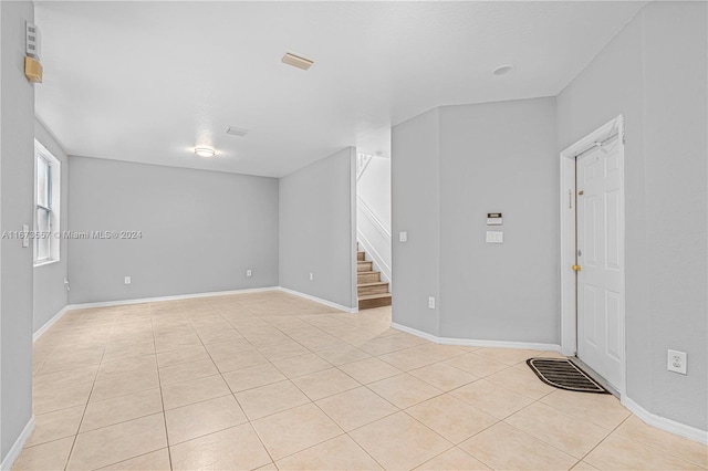 empty room featuring light tile patterned floors