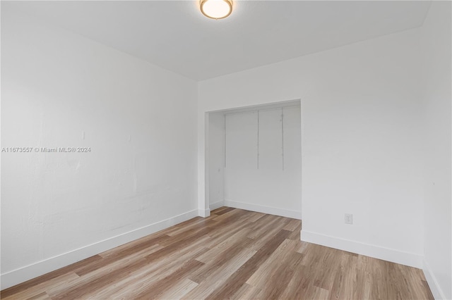 spare room with light hardwood / wood-style flooring