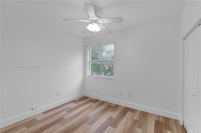 unfurnished room featuring light hardwood / wood-style floors and ceiling fan