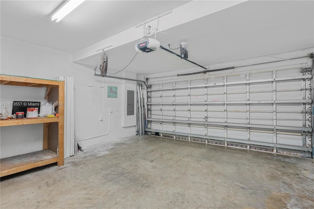 garage featuring a garage door opener and electric panel