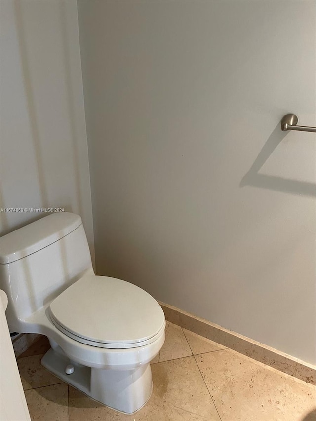 bathroom featuring toilet and tile patterned floors