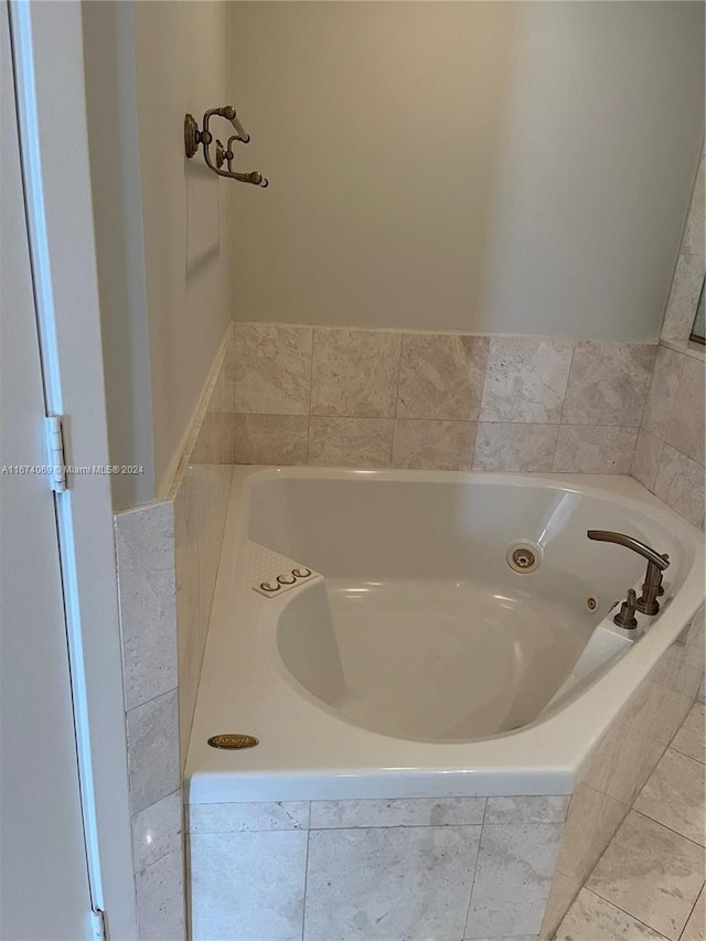 bathroom with tiled bath