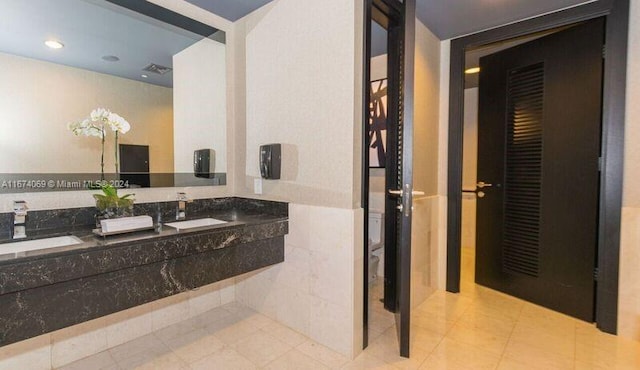 bathroom featuring tile patterned floors and vanity