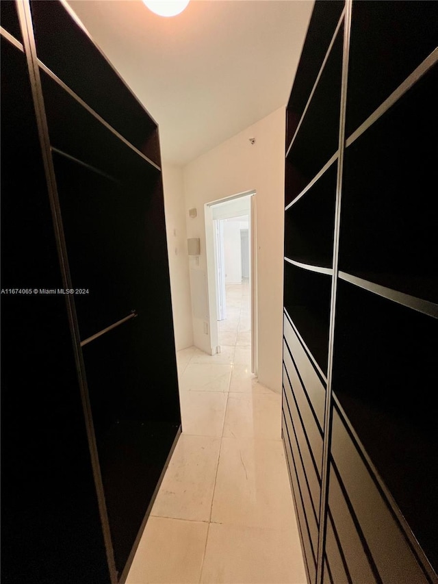 hallway featuring tile patterned floors