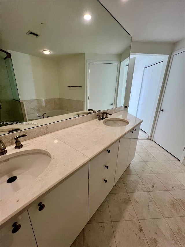 bathroom featuring tile patterned floors and vanity