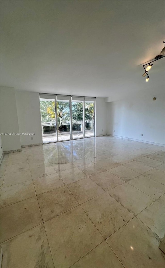 spare room featuring a wealth of natural light