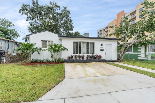 view of front of property with a front lawn