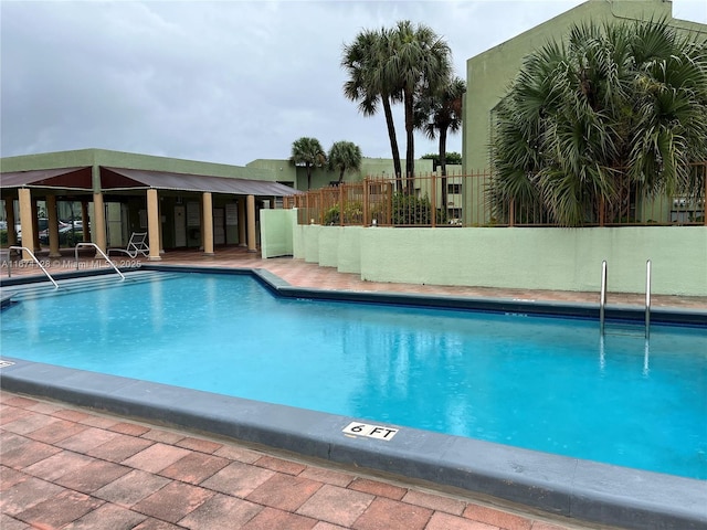 view of swimming pool with a patio area