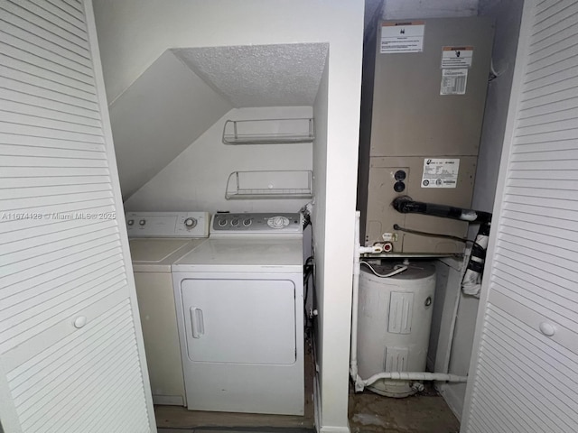 washroom featuring a textured ceiling and independent washer and dryer