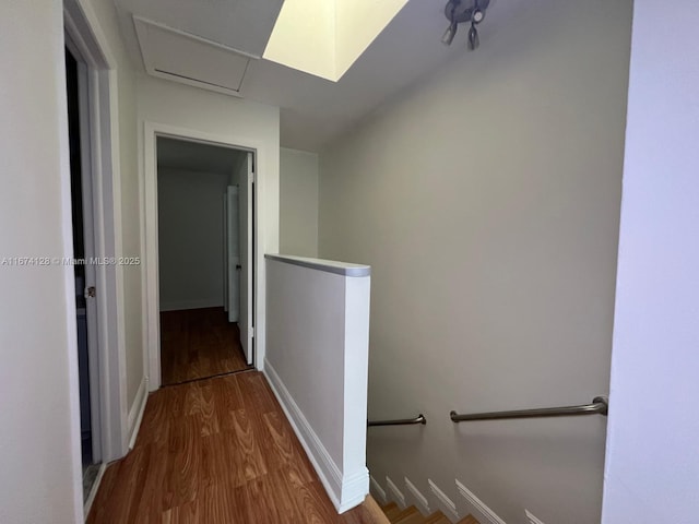 corridor with wood-type flooring