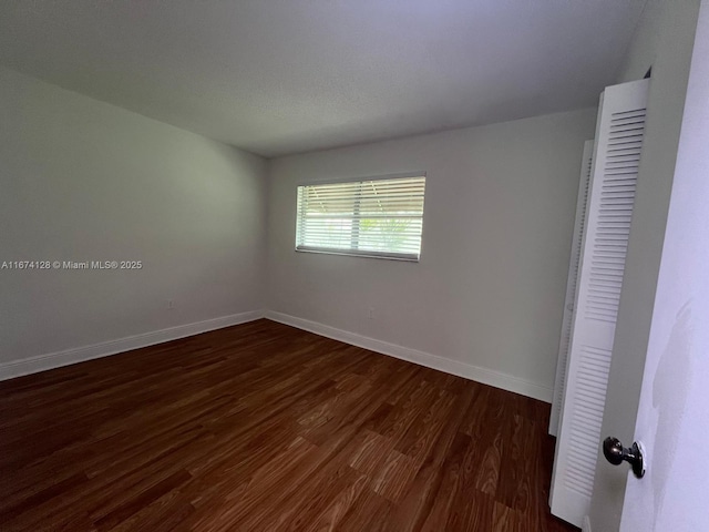 empty room featuring dark hardwood / wood-style floors