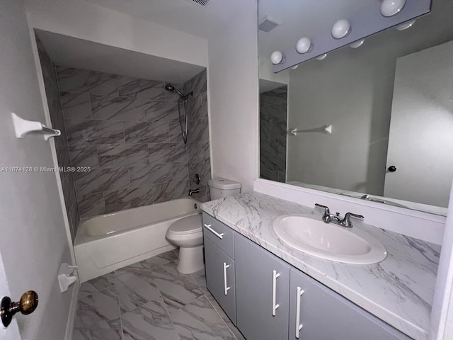 full bathroom with tiled shower / bath combo, vanity, and toilet