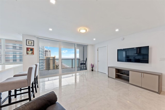 living room featuring floor to ceiling windows