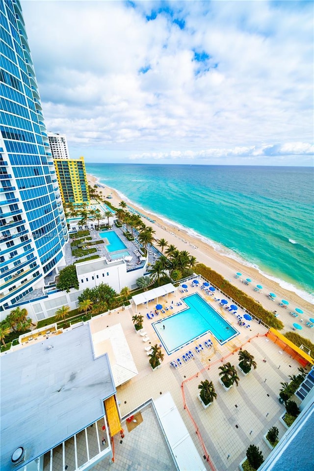 aerial view featuring a view of the beach and a water view