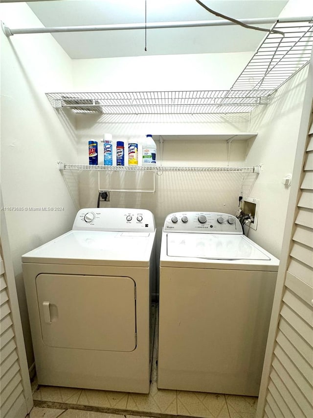 laundry room featuring washing machine and clothes dryer