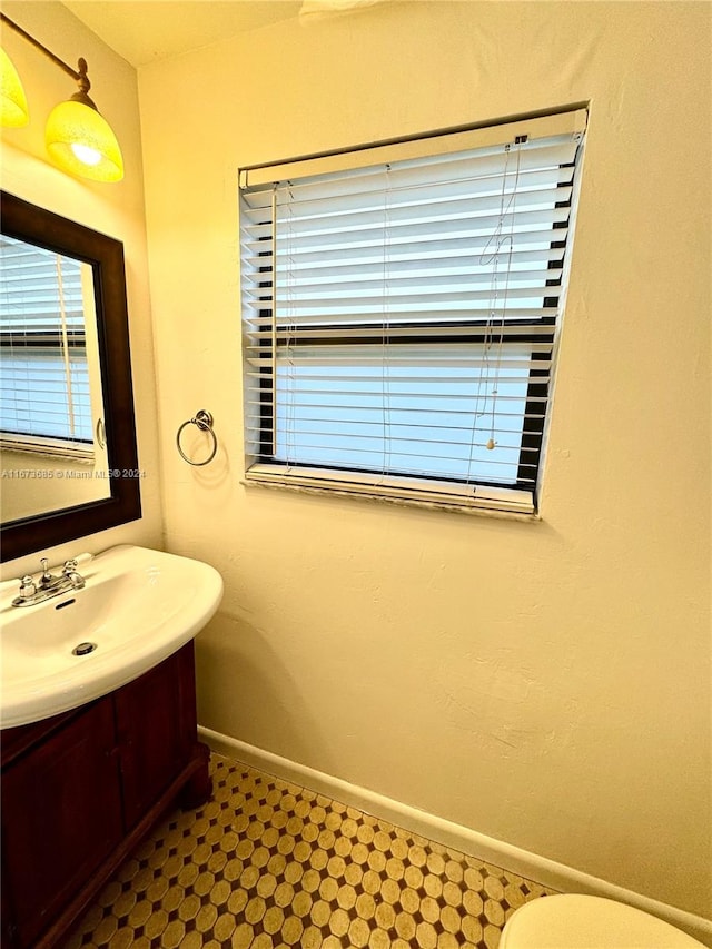 bathroom featuring toilet and vanity