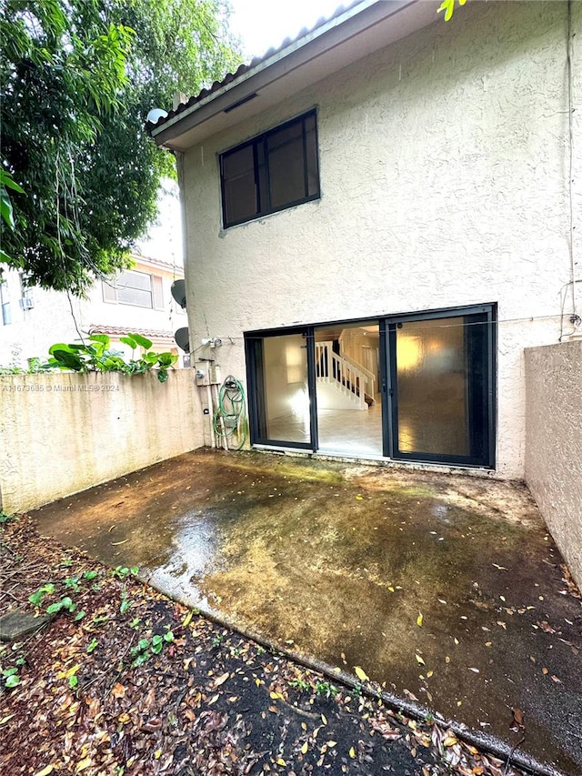 rear view of property with a patio