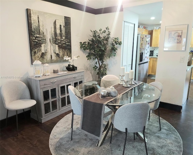 dining area featuring dark hardwood / wood-style floors