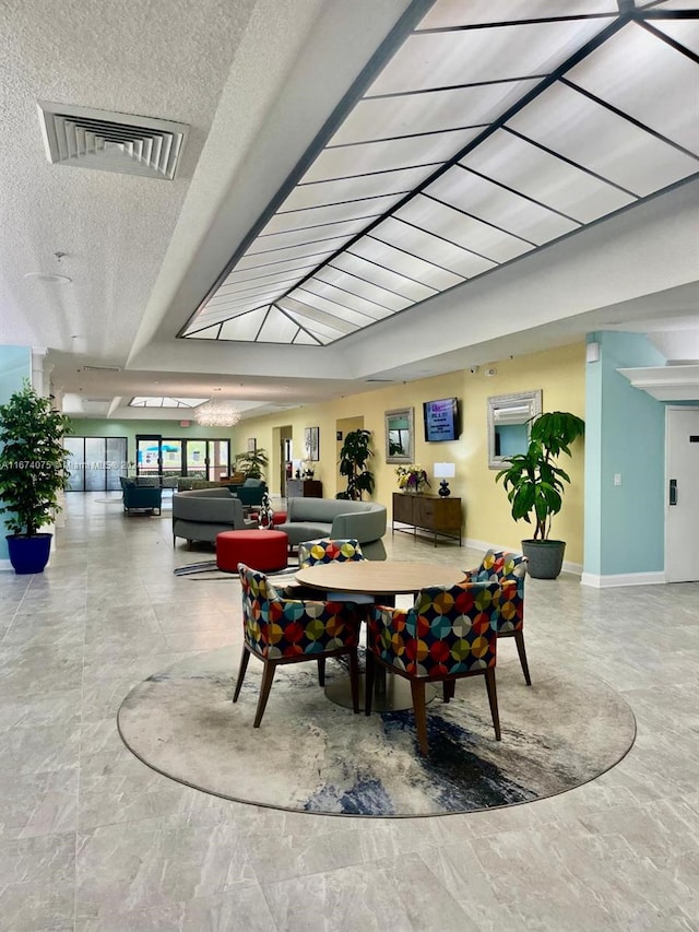 dining area featuring a textured ceiling