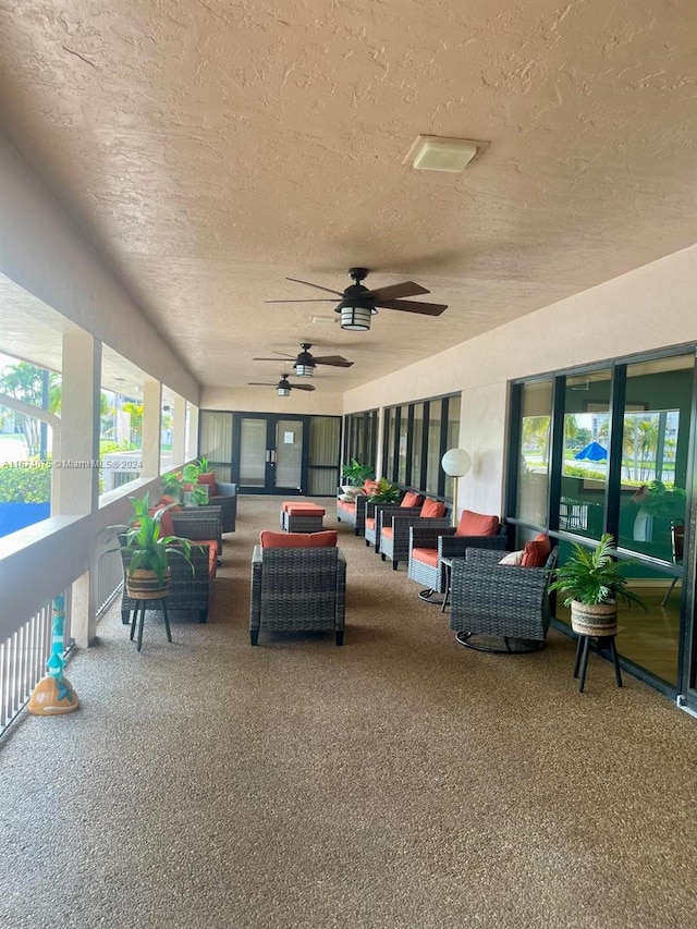 view of patio featuring an outdoor hangout area and ceiling fan