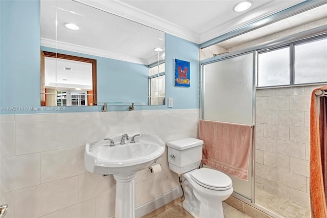 bathroom with a shower with curtain, tile walls, tile patterned floors, and toilet