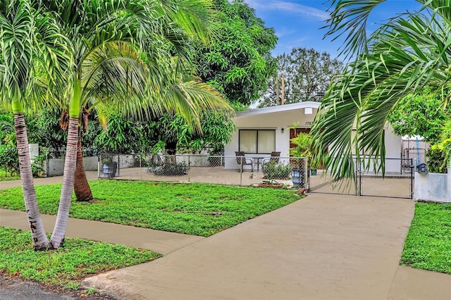 view of community with a gate and a fenced front yard