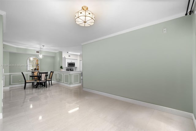 tiled dining room with ornamental molding