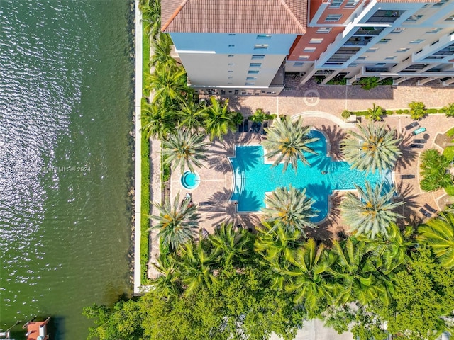 birds eye view of property with a water view