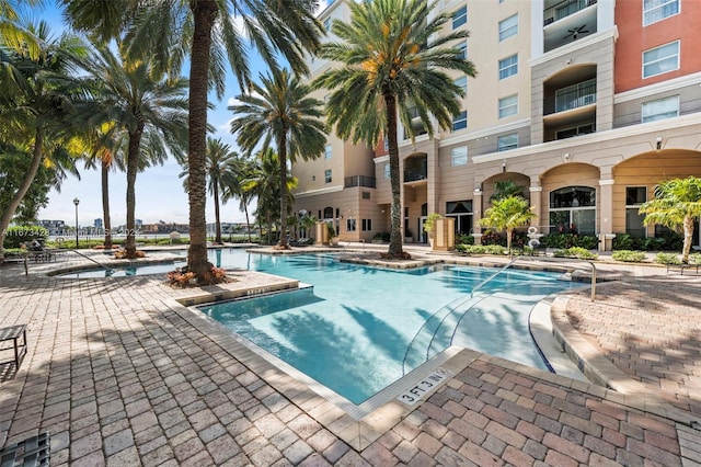 view of swimming pool with a patio