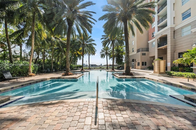 view of pool with a water view