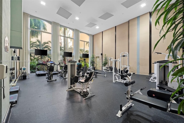 workout area featuring floor to ceiling windows