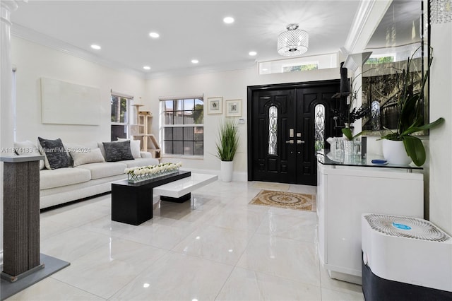 foyer featuring crown molding, baseboards, and recessed lighting