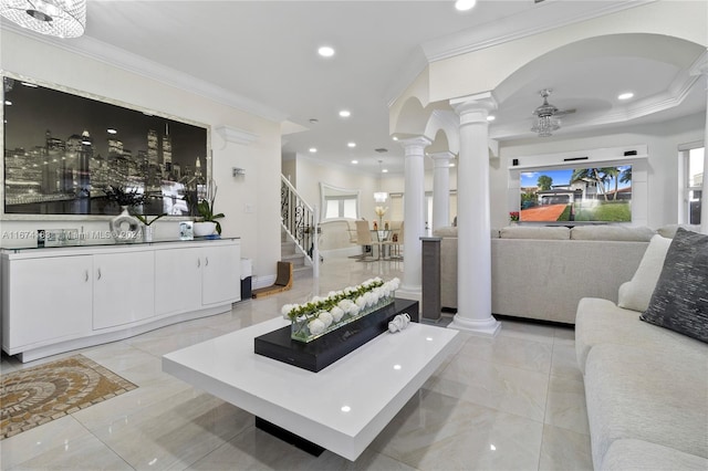 living area featuring decorative columns, recessed lighting, stairway, and crown molding