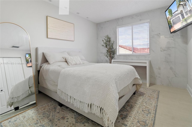 bedroom with multiple windows