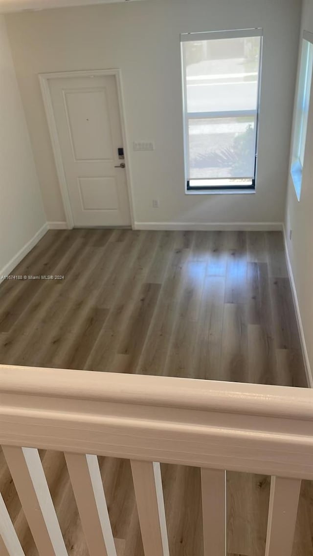 spare room featuring dark hardwood / wood-style floors