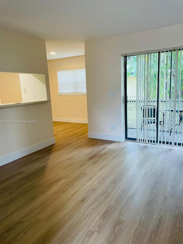 unfurnished room featuring light hardwood / wood-style flooring