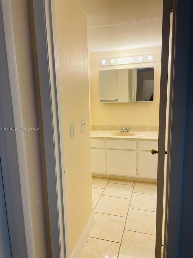 bathroom with vanity and tile patterned floors