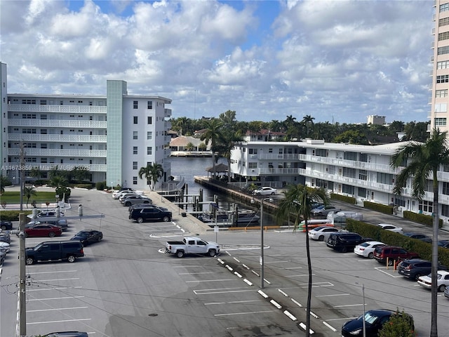 3181 S Ocean Dr Unit 501, Hallandale Beach, FL 33009 - view of building exterior with uncovered parking and a water view