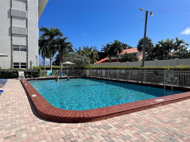 3181 S Ocean Dr Unit 501, Hallandale Beach, FL 33009 - community pool featuring a patio and fence