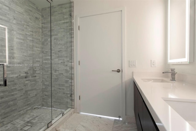 bathroom with walk in shower and vanity