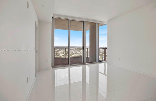 tiled empty room with expansive windows