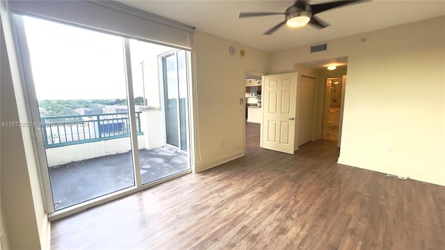 unfurnished room with wood-type flooring and ceiling fan