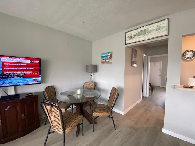 851 Atlantic Shores Blvd Unit 225, Hallandale Beach, FL 33009 - dining space with baseboards and wood finished floors