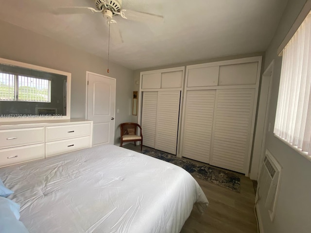 851 Atlantic Shores Blvd Unit 225, Hallandale Beach, FL 33009 - bedroom featuring two closets, a wall unit AC, a ceiling fan, and wood finished floors