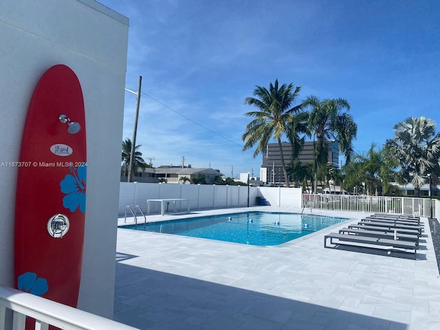 851 Atlantic Shores Blvd Unit 225, Hallandale Beach, FL 33009 - community pool featuring a patio and fence